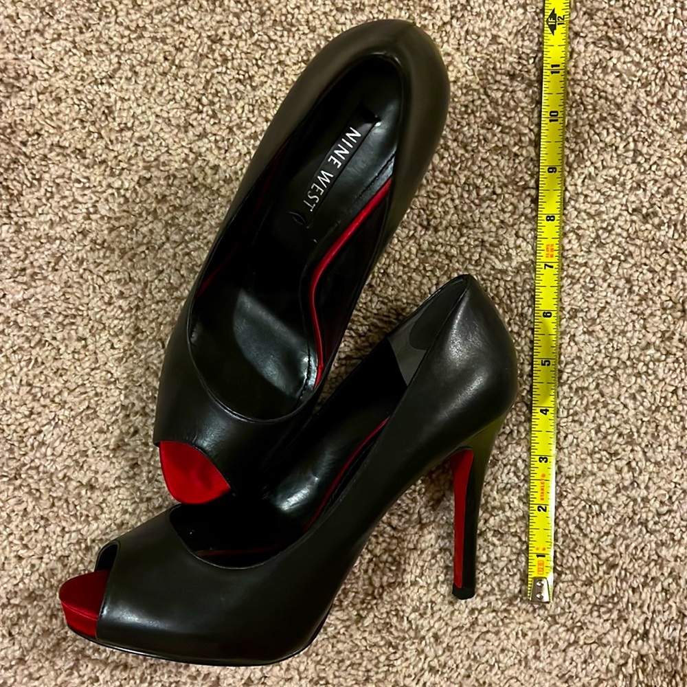 Nine West black leather peep toes with red satin and red bottom detail